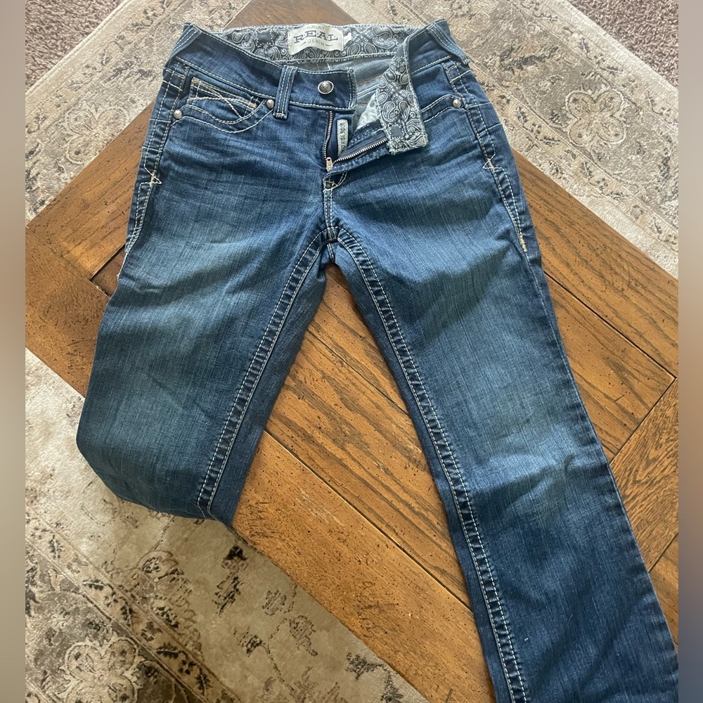 R.E.A.L. Mid Rise Stretch Entwined Boot Cut Jean